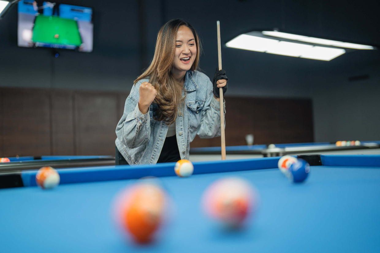 girl happy making her pool shot