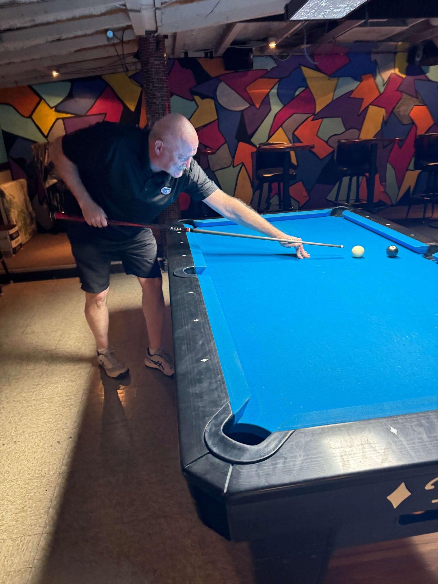 Young studly man playing pool with BeatStix